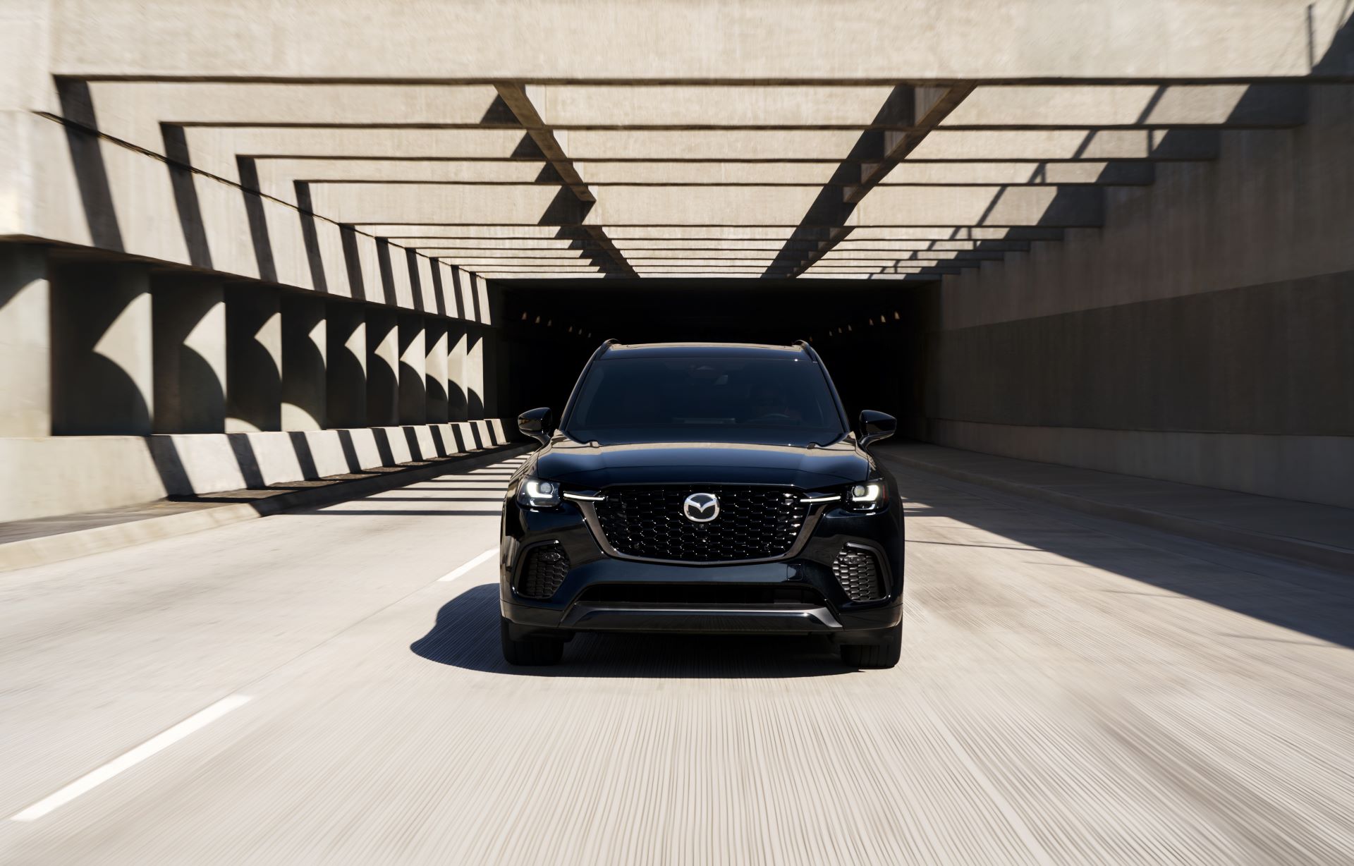 Vehicle equipped with Mazda safety features on the road