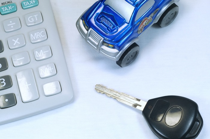 Mazda financing materials including calculator and car keys