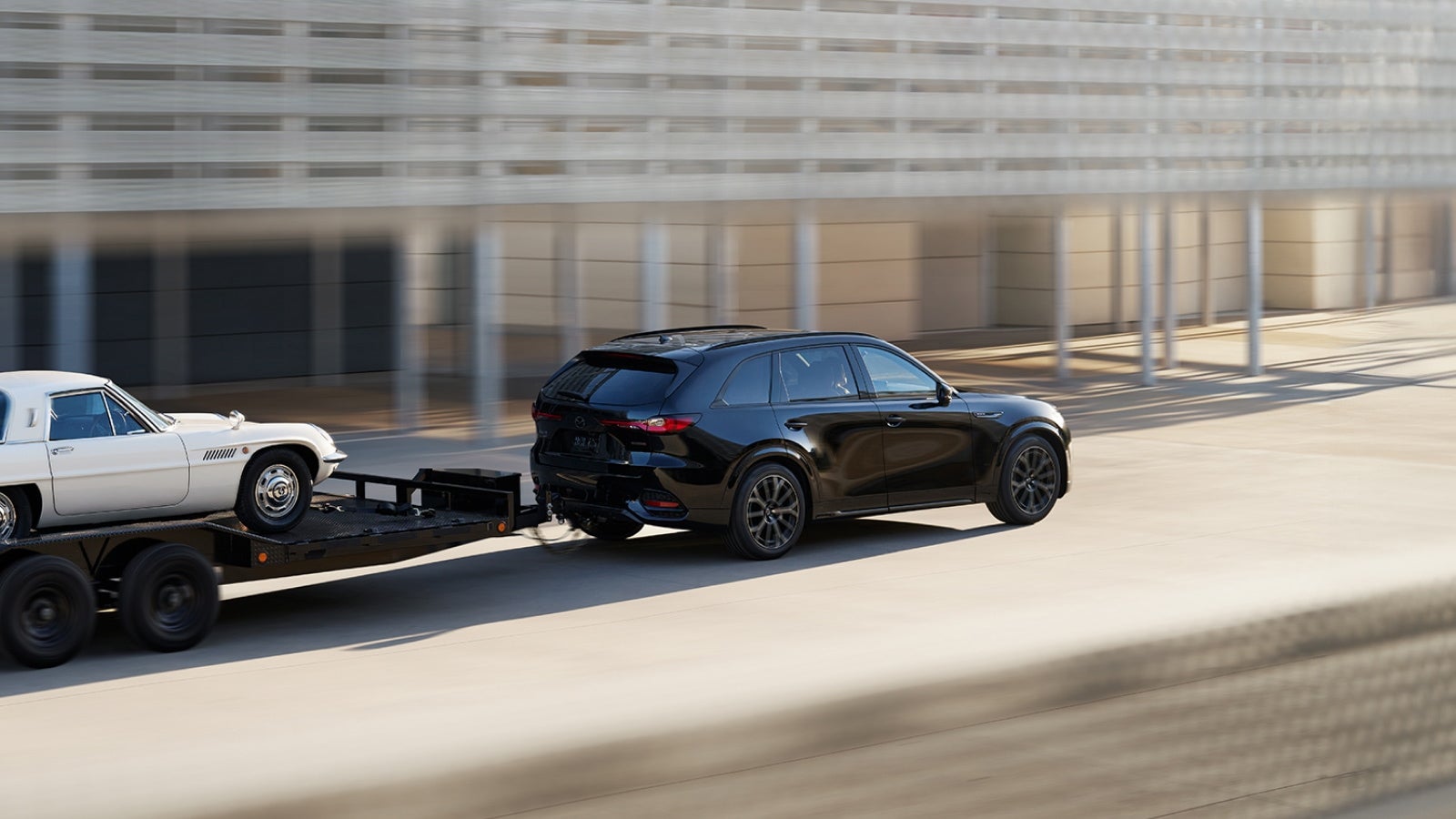 Mazda lease SUV towing a vehicle